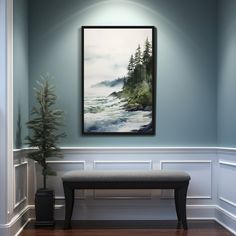 a painting hanging on the wall above a bench in a room with wood flooring