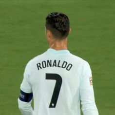 a man standing on top of a soccer field