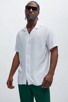 Model Height: 6'2 - Wearing Large Big & Tall: Height 6'3 - Wearing XXXL Available In Red, Black, And White. Short Sleeve Fold Down Collar Button Front 100% Viscose Imported | Mens Dawson Relaxed Short Sleeve Cuban Collar Shirt in White size Large by Fashion Nova Classic Camp Collar Tops For Beach, Classic Beach Tops With Camp Collar, Classic Short Sleeve Vacation Tops, Classic Short Sleeve Tops For Vacation, Classic Collared Beach Tops, Solid Color Spread Collar Top For Vacation, Classic Relaxed Fit Beach Tops, Classic Relaxed Fit Tops For Beach, Classic Beach Tops With Relaxed Fit