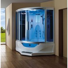 a bathroom with a round shower in the middle and wooden flooring next to it