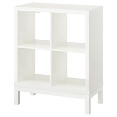 a white bookcase with four shelves on each side