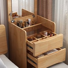 a wooden vanity with drawers in front of a window next to a white bed and chair