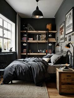 a bedroom with black walls and wooden floors