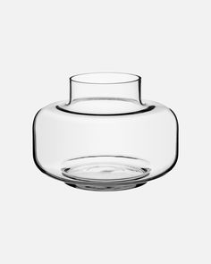 a clear glass vase sitting on top of a table