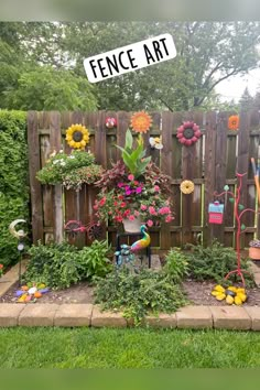 a fence with flowers and gardening tools in it