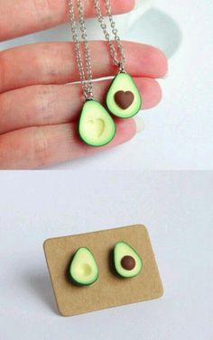 two pieces of avocado are being held by someone's hand