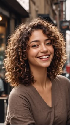 If you’re looking to enhance your curls with extra volume and dynamic texture, a Layered Curly Bob is your go-to. By incorporating layers, this style adds movement and lightness to thick curly hair, making it one of the preferred curly bob haircuts with layers for those seeking a youthful and vibrant appearance Curly Hairstyles Layers Medium, Curly Hair Short Layers Mid Length, Chic Curly Bob, Natural Curl Haircut, Haircuts For Girls With Curly Hair, Layered Bob Curly Hair, Bob Cut For Curly Hair, Round Layers Curly Hair, Light Brown Bob Haircut