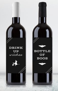 two bottles of wine with bats on the top and drink up witches written on them