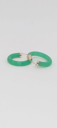 GREEN Jade Hoop Earrings in 14K Yellow Gold. 24 millimeters. Green Jade 14k Yellow Gold Hoop Earring. JADE Lover. Product Info: -Earring diameter: 24 millimeters -Metal: 14K. -Stone: Green Jade. -Colors: Green. -Finish: 14k Yellow gold. -Stone dimension: 4mm -Nice Gift box is included. Green 14k Gold Hoop Earrings, Green Pierced Hoop Earrings, Green Jade Hoop Jewelry, Small Green Pierced Hoop Earrings, Green Hoop Earrings For May Birthstone, Green May Birthstone Hoop Earrings, Green Hoop Earrings Gift, Green Hoop Earrings For Gift, Green Pierced Hoop Earrings For Anniversary