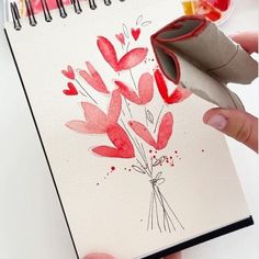 someone is making a flower card with watercolors