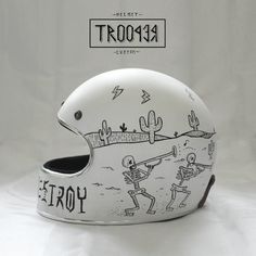 a white helmet with drawings on it