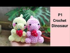 two small crocheted animals sitting next to each other