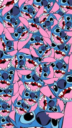 a large group of blue and pink sharks with their mouths open in the shape of teeth