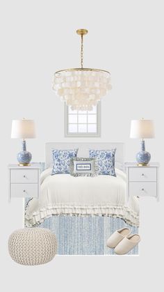 a white bedroom with blue and white accessories on the bed, chandelier, dressers, lamps, and rug