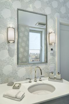 a bathroom sink with a large mirror above it