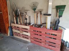 a wooden pallet filled with lots of gardening tools