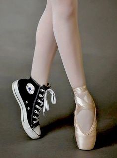 the legs and feet of a ballerina in ballet shoes