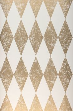 an abstract diamond pattern in gold and white with some light brown highlights on the background