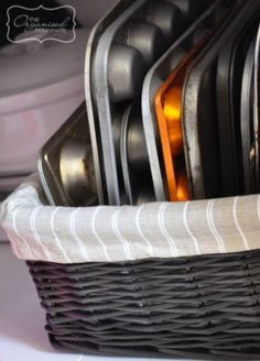 a basket filled with silverware sitting on top of a table