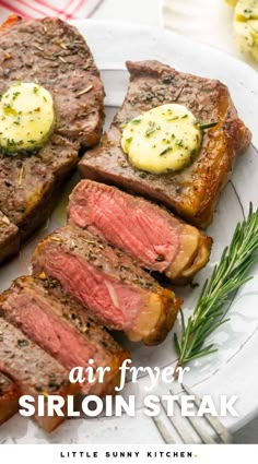 air fryer sirloin steak on a white plate with rosemary garnish