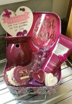 a pink gift box filled with personal care items