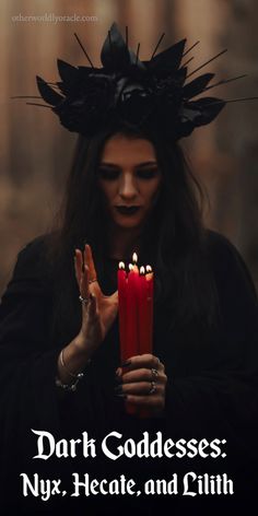 a woman holding two candles with the words dark goddesss ny, hecate, and ruth