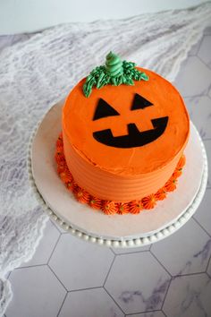 there is a cake that looks like a jack o lantern