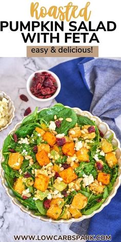 roasted pumpkin salad with feta and cranberries in a bowl on a marble table