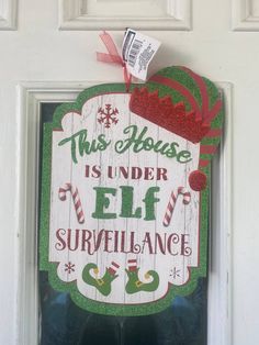 this house is under elf surveillance door sign