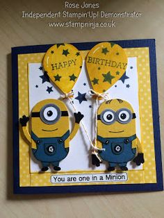 a birthday card with two minion balloons