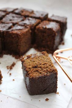 some brownies sitting on top of white paper