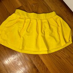 Never Worn Yellow Stretch Skort For Spring, Amazon Casual Fitted Skirt, Casual Fitted Skirt By Amazon, Casual Yellow Mini Skirt For Party, Casual Yellow Stretch Skort, Casual Yellow Pleated Mini Skirt, Casual Yellow Flared Mini Skirt, Amazon Casual Mini Skirt Bottoms, Spring Yellow Pleated Mini Skirt