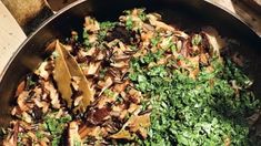 a pan filled with food sitting on top of a wooden table