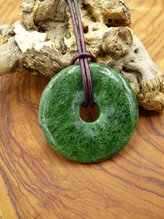 40 mm Diopside protective donut ~ an absolute rarity Includes antique brown 2 mm leather cord for knotting. We hope you enjoy browsing our shop, if you like what you see, we would be very happy if you would follow us here :) "A stone is the condensed history of the universe" ~Art of Nature Berlin~ Donut Gifts, Art Of Nature, Crystals Jewelry, Universe Art, Necklace Green, Green Necklace, Jewelry Pendant, Healing Stone, Natural Healing