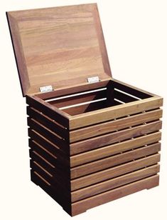 a wooden box with six compartments on the front and one lid open to show its contents