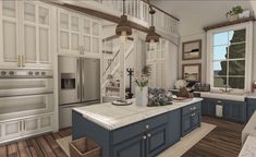 a large kitchen with blue cabinets and white counter tops, along with wooden floors is shown in this image