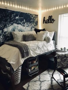 a bedroom with a bed, chair and lights on the wall above it is decorated in black and white