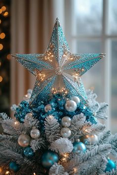 a blue and white christmas tree decorated with ornaments