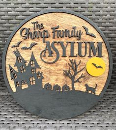 a wooden sign that says the chirp family asym with a house and cat on it