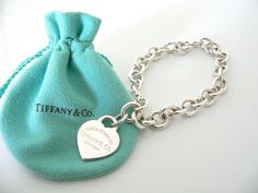 Overview:Offered for sale is a wonderful and mint Tiffany and Co.  Sterling Silver "Return to Tiffany" Heart Tag bracelet - in a rare and hard to find longer length - 8.5 Inches.   The piece is  made from substantial and bright Tiffany silver, and yet retains a very  feminine feel to it.   It is a classic Tiffany piece that will most  certainly be a piece that you will be used over and over again, so it is  great value for the money!  It is a wonderful piece that fits a  lifestyle on the go -- t Tiffany Like Shade Black And Whote, Please Return To Tiffany And Co, Large Family Love Tiffany, Bracelets Tiffany & Co., Tiffany And Co Bracelet Sterling Silver, Elegant Bracelet Tiffany & Co., Tiffany Charm Bracelet Tiffany & Co., Tiffany & Co. Bracelet, Return To Tiffany Bead Bracelet