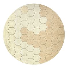 a round rug with hexagonal shapes in beige and white colors on a white background