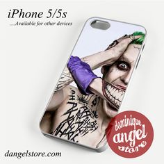 an iphone case with the joker face painted on it's back and purple gloves