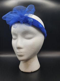 Royal Blue Fascinator/Headband Make a statement with this royal blue fascinator a stylish meshed bow. It features a delicate sheer tulle overlay, enhanced by vibrant rhinestones underneath, adding a touch of sparkle. This elegant headband is perfect for special occasions, weddings, or a fashionable day out, combining sophistication and glamour effortlessly. Royal Blue Fascinator, Elegant Headband, Blue Fascinator, Turban Headbands, Turbans, Hair Accessories Headbands