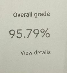 a close up of a piece of paper with the words overall grade 957 99 % view details