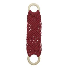 a red crochet key chain hanging on a white hook with an o - ring