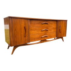 a large wooden cabinet with drawers on one side and an open drawer on the other