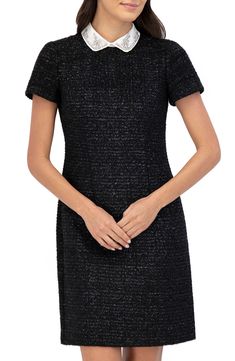 Get the layered look you love without any extra bulk in this shimmer-kissed shift dress that's topped by a beautifully embellished collar. 36" length Back zip closure Peter Pan collar Short sleeves Lined 100% polyester Hand wash, dry flat Imported Shift Dress With Collar, 60s Shift Dress, Tweed Shift Dress, Black And Silver Dress, Embellished Collar, Peter Pan Collar Dress, Eliza J, Floral Shift Dress, Black Sheath Dress