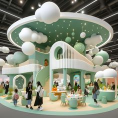 a group of people standing in front of a green and white building with clouds on the ceiling