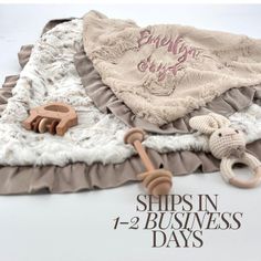 there is a stuffed animal on top of a blanket with the words ships in 1 - 2 - 2 - business days