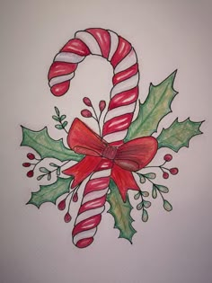 a drawing of a candy cane and holly